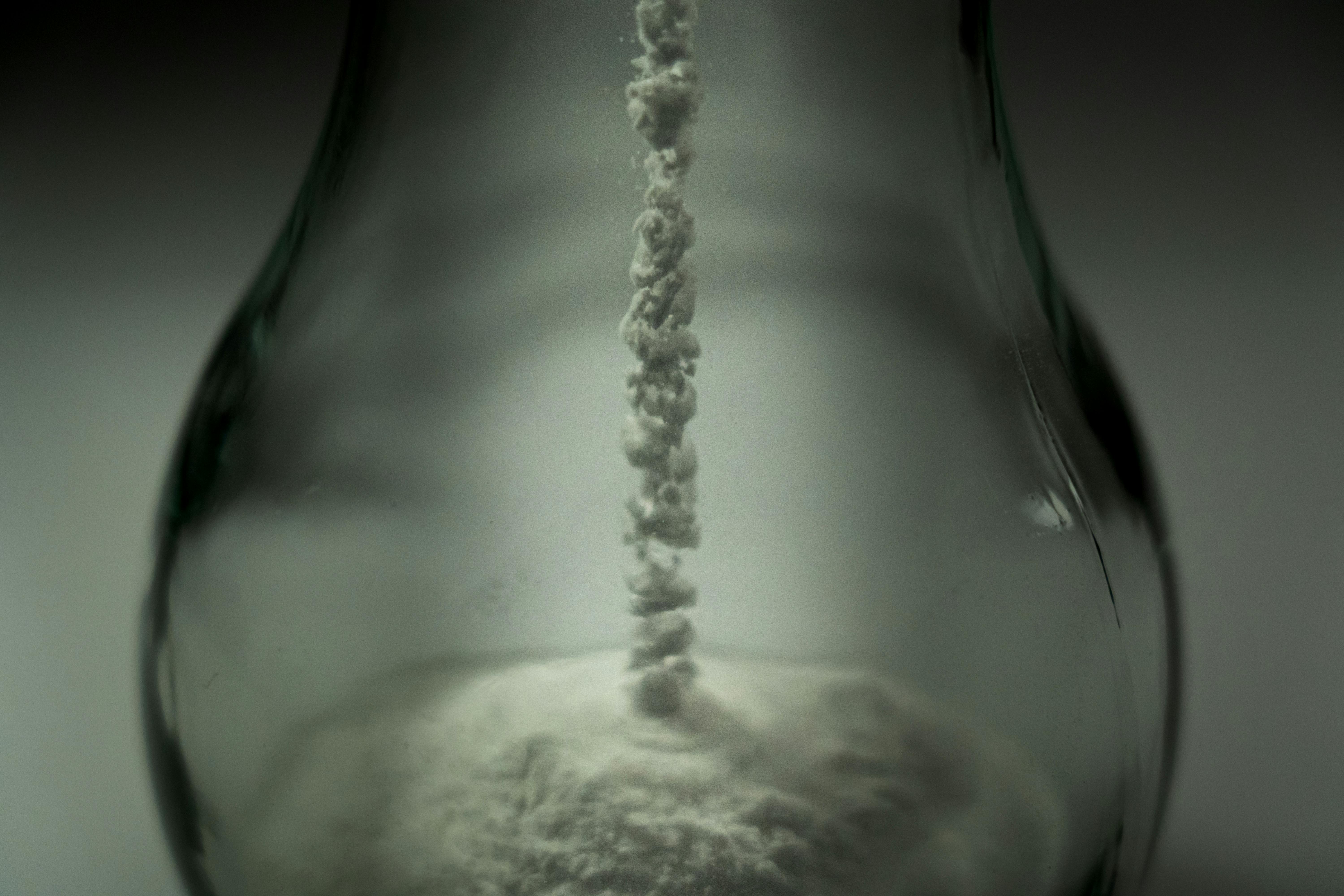 Lab technician kept a small chemical bottle in a stand